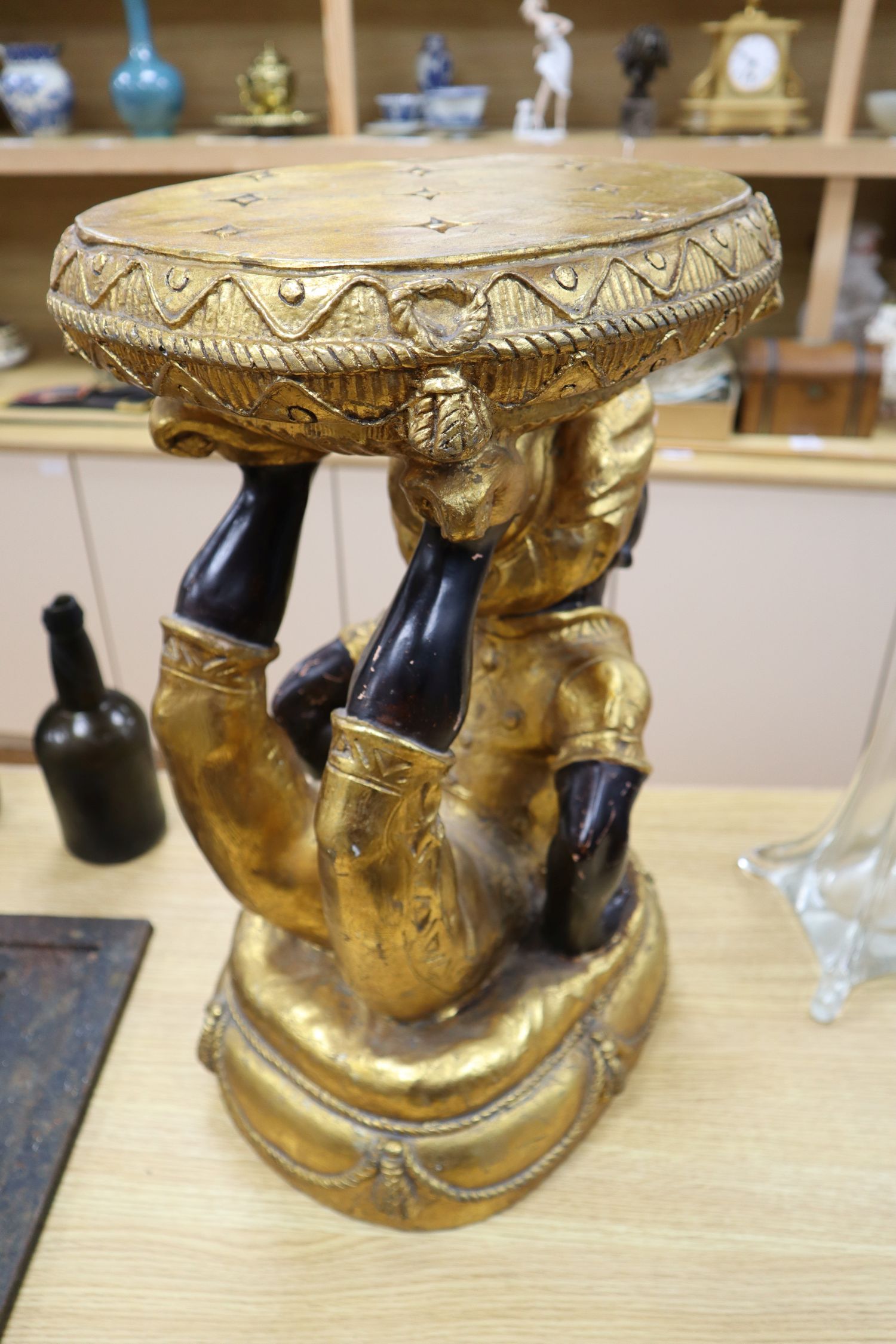 A composition blackamoor stool, height 57cm